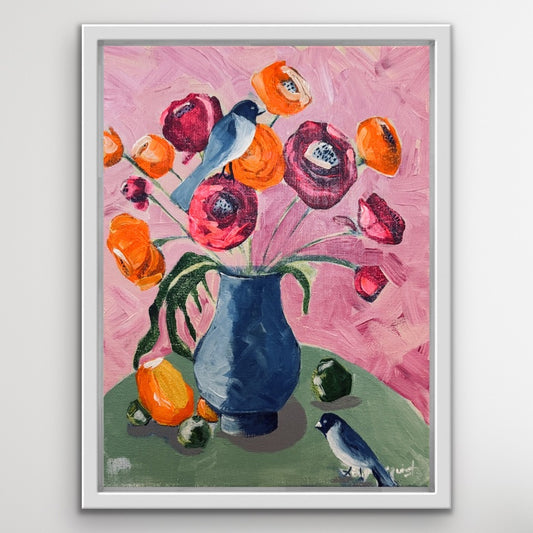 Framed painting of a blue vase with colorful flowers on a pink background