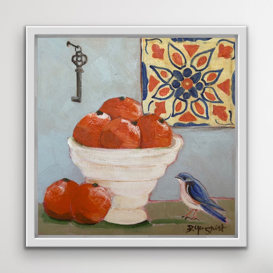 Framed original acrylic still life painting with oranges, a bird, and a decorative tile on a light blue gray background.