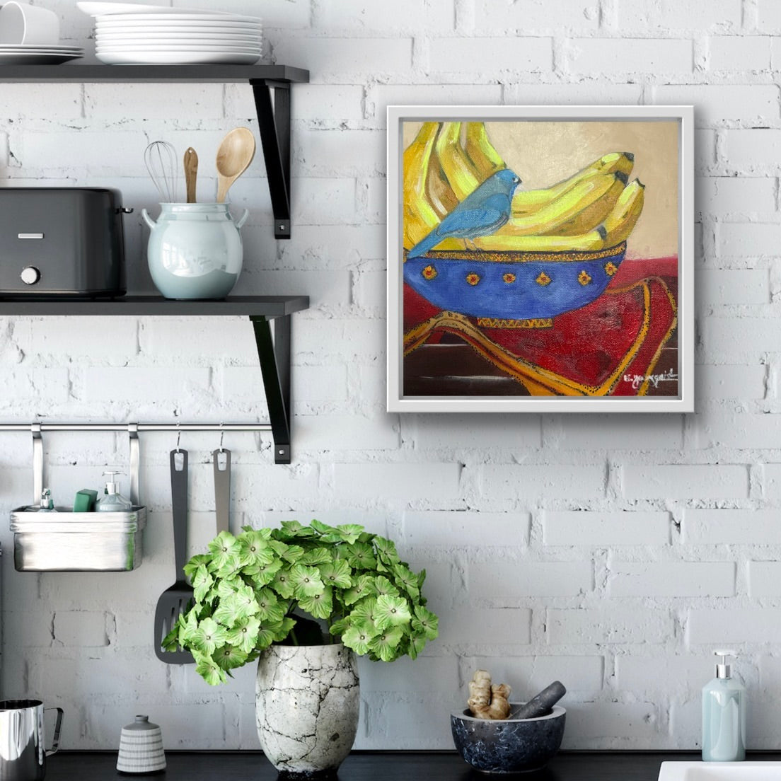 Colorful painting of a blue bird on a red and yellow bowl in a kitchen setting for home decor