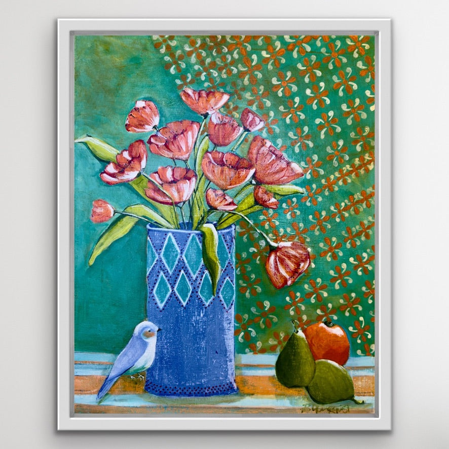 Framed artwork of a blue vase with pink flowers, a bird, and fruit on a patterned background.