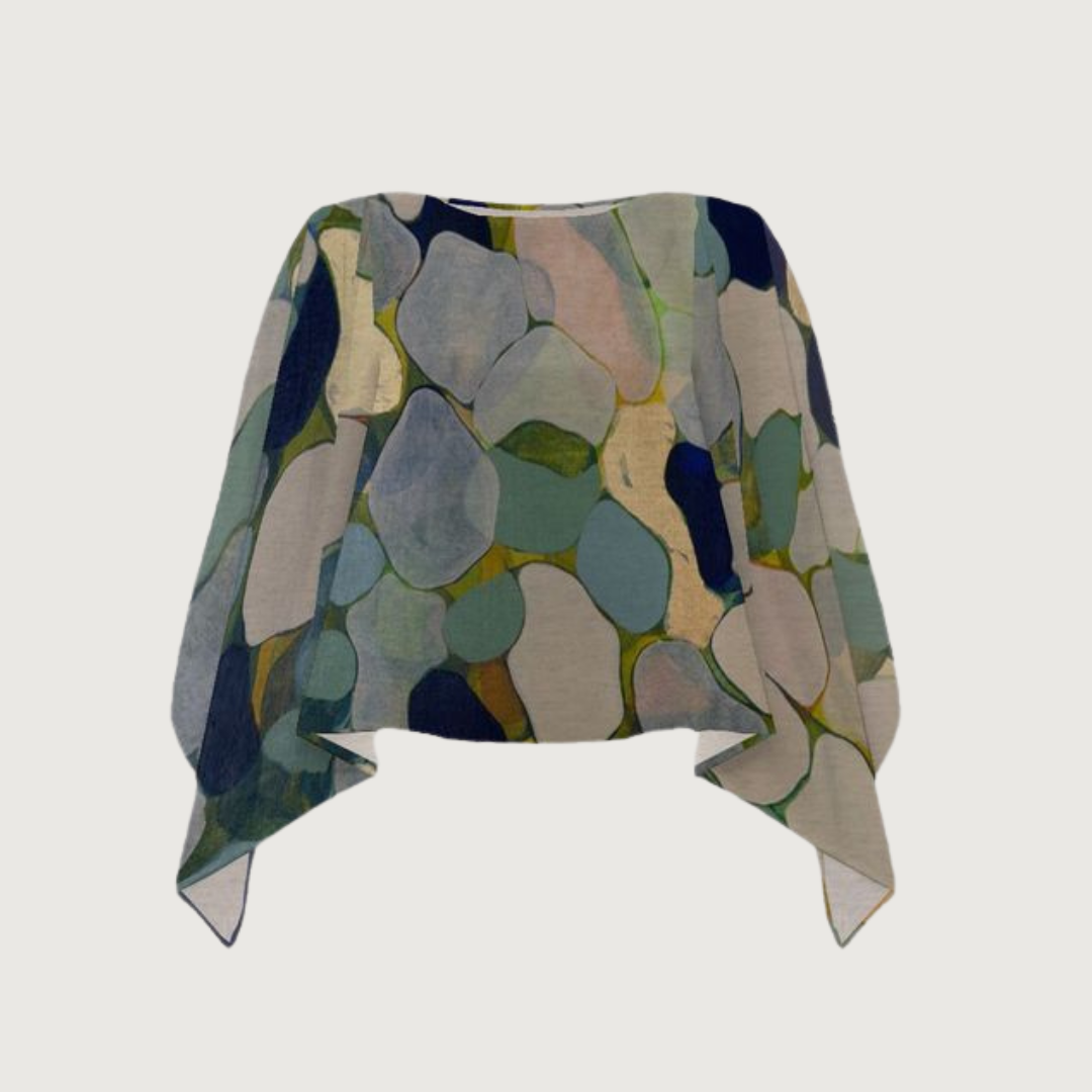 A beautiful abstract luxury artwear shawl in shades of blue, green, and cream. A lovely gift for the woman who has everything.